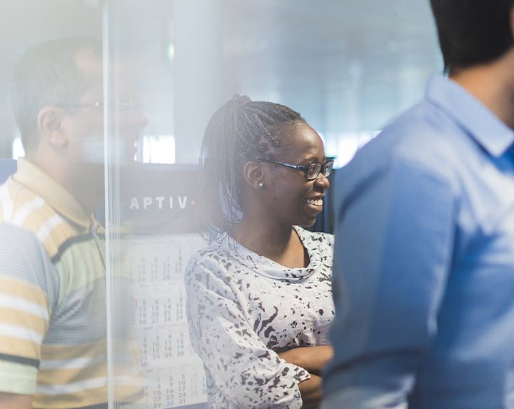 Three employees at an Aptiv location