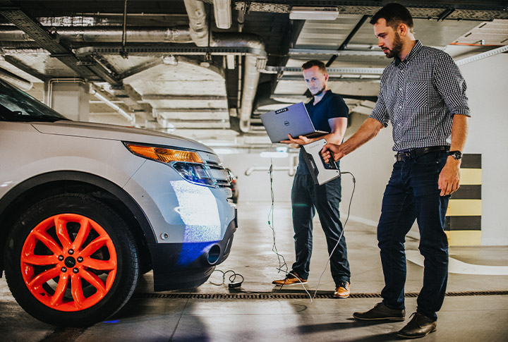 Engineers working on a car