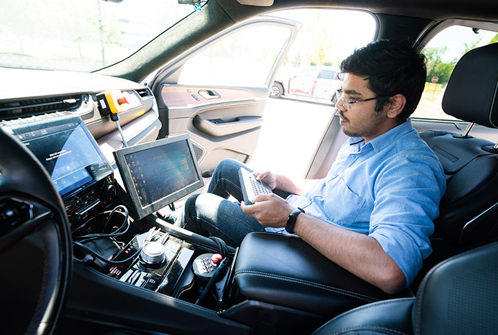 Engineer working on a car