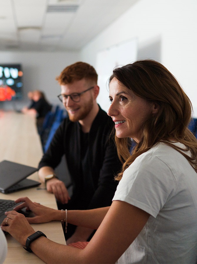 Man and woman employees at Aptiv Tech Center