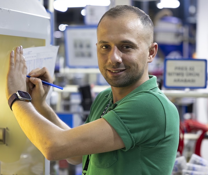 Aptiv employee working on a machinery