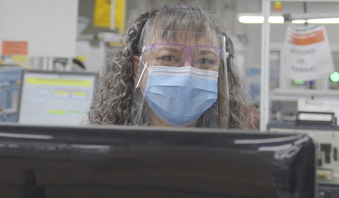 Woman wearing safety mask and glasses